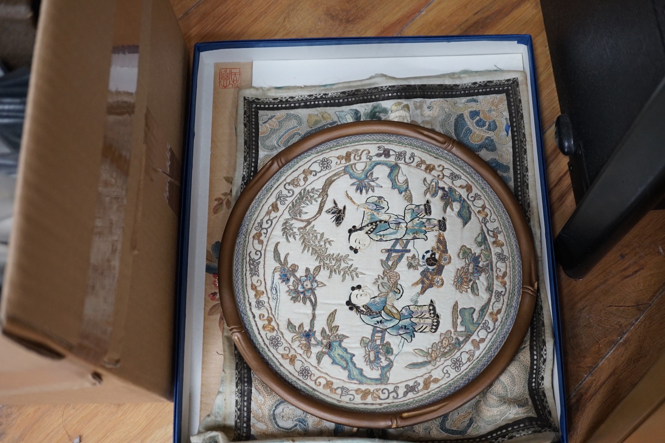 Three framed Chinese embroidered silk sleeve panels, 71 x 37cm, together with two others
